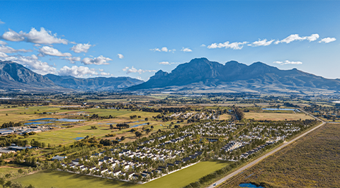 Estate Overview Image – Wide view of the luxury Avec la Terre estate in Paarl, showcasing elegant residences, green spaces, and the surrounding natural landscape.